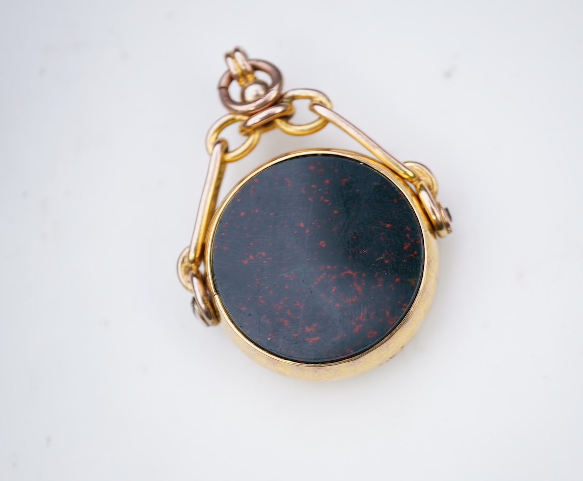 An enamel ring and a hardstone swivel fob seal